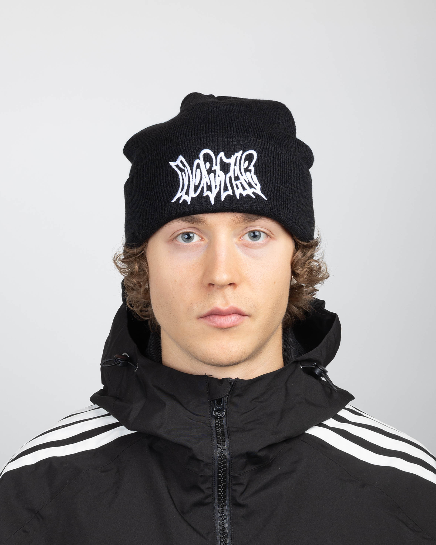 Black beanie full front view on a model