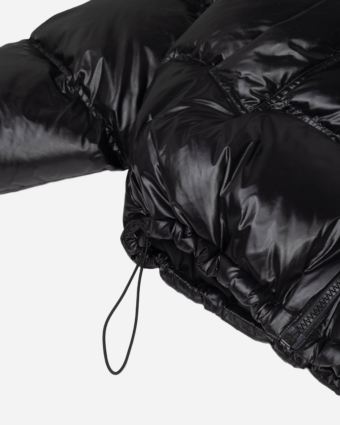 Black puffer jacket adjustable waist detail