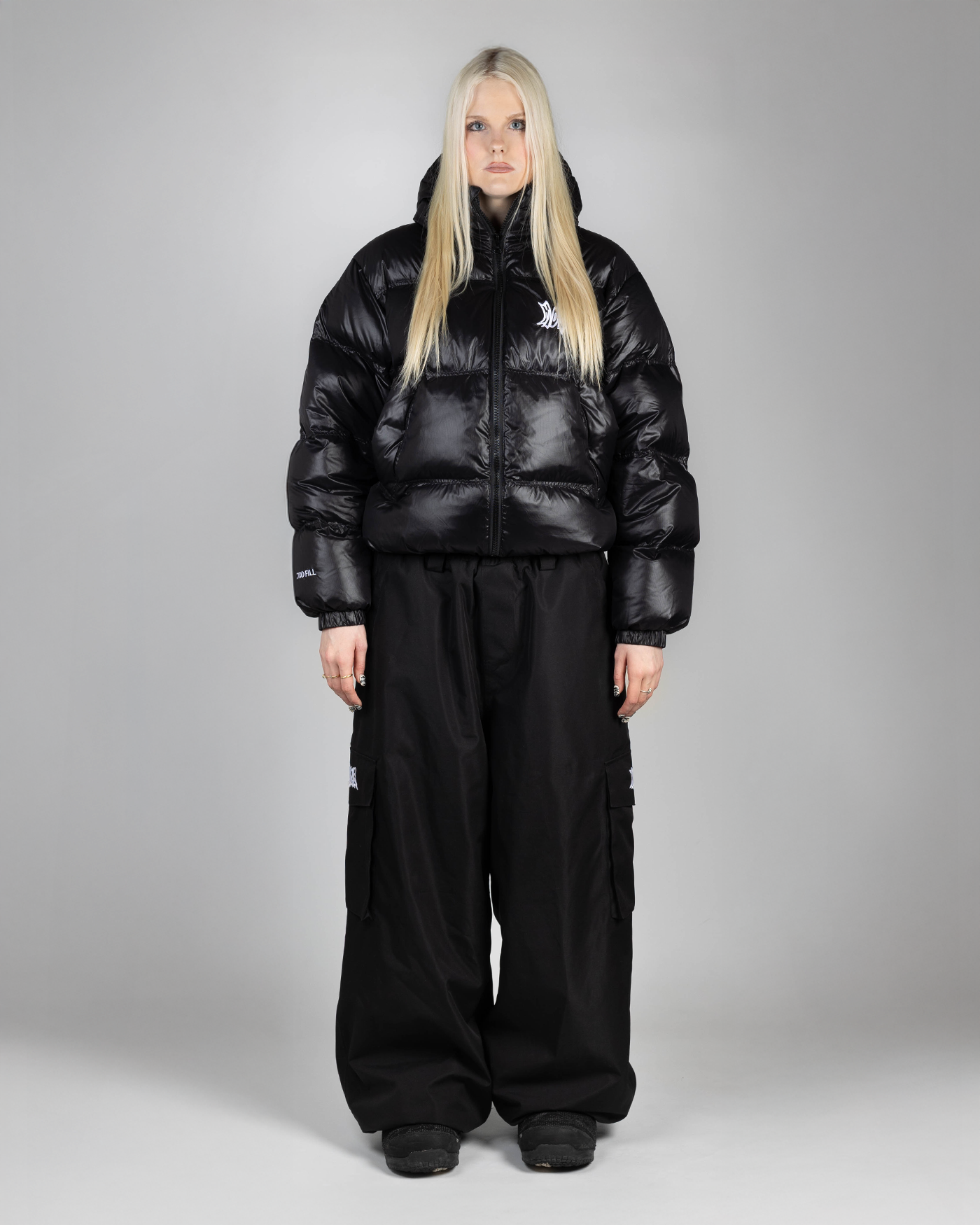 Black puffer front view on woman (Hilla is 175cm wearing size M)