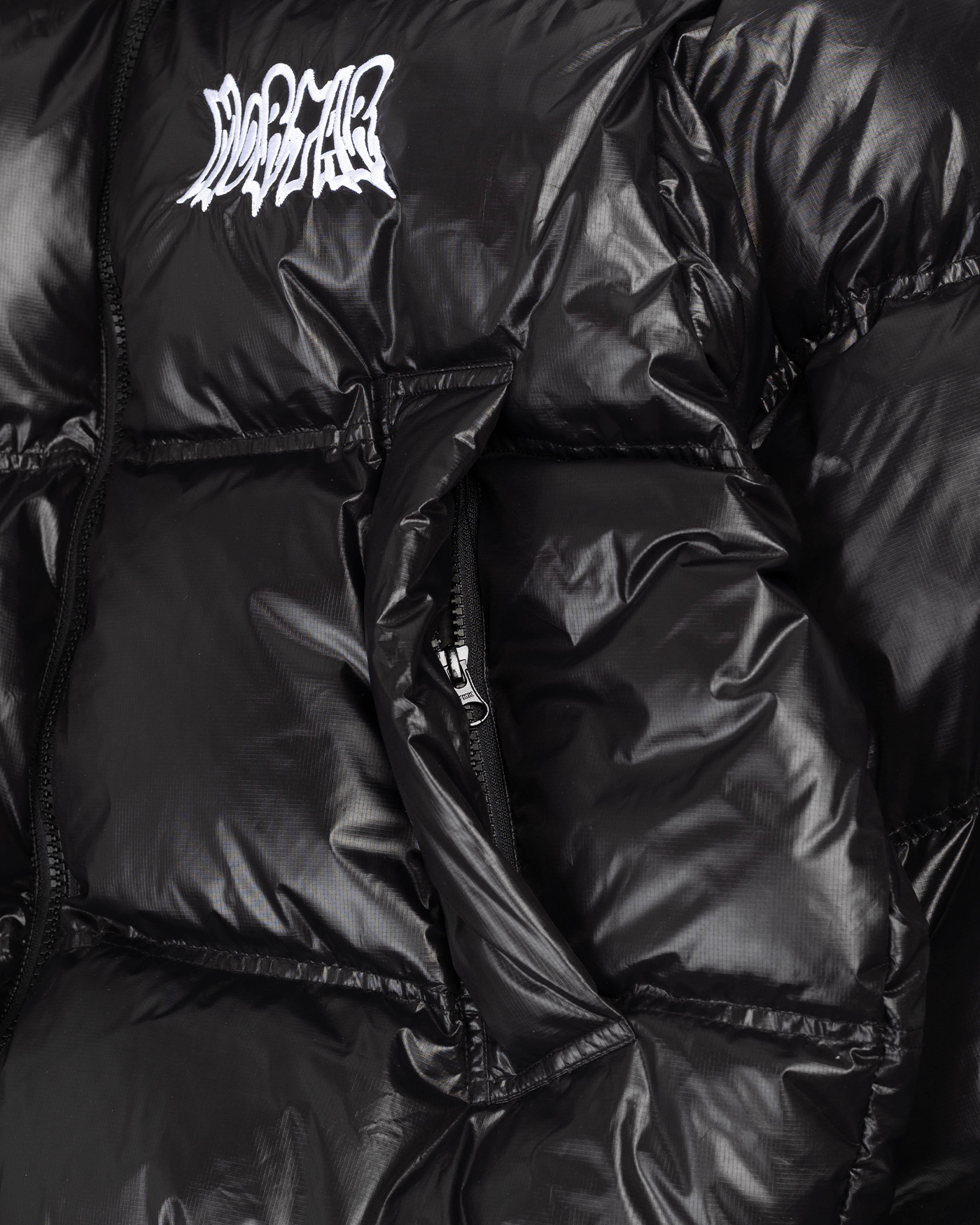 Black puffer jacket pocket detail