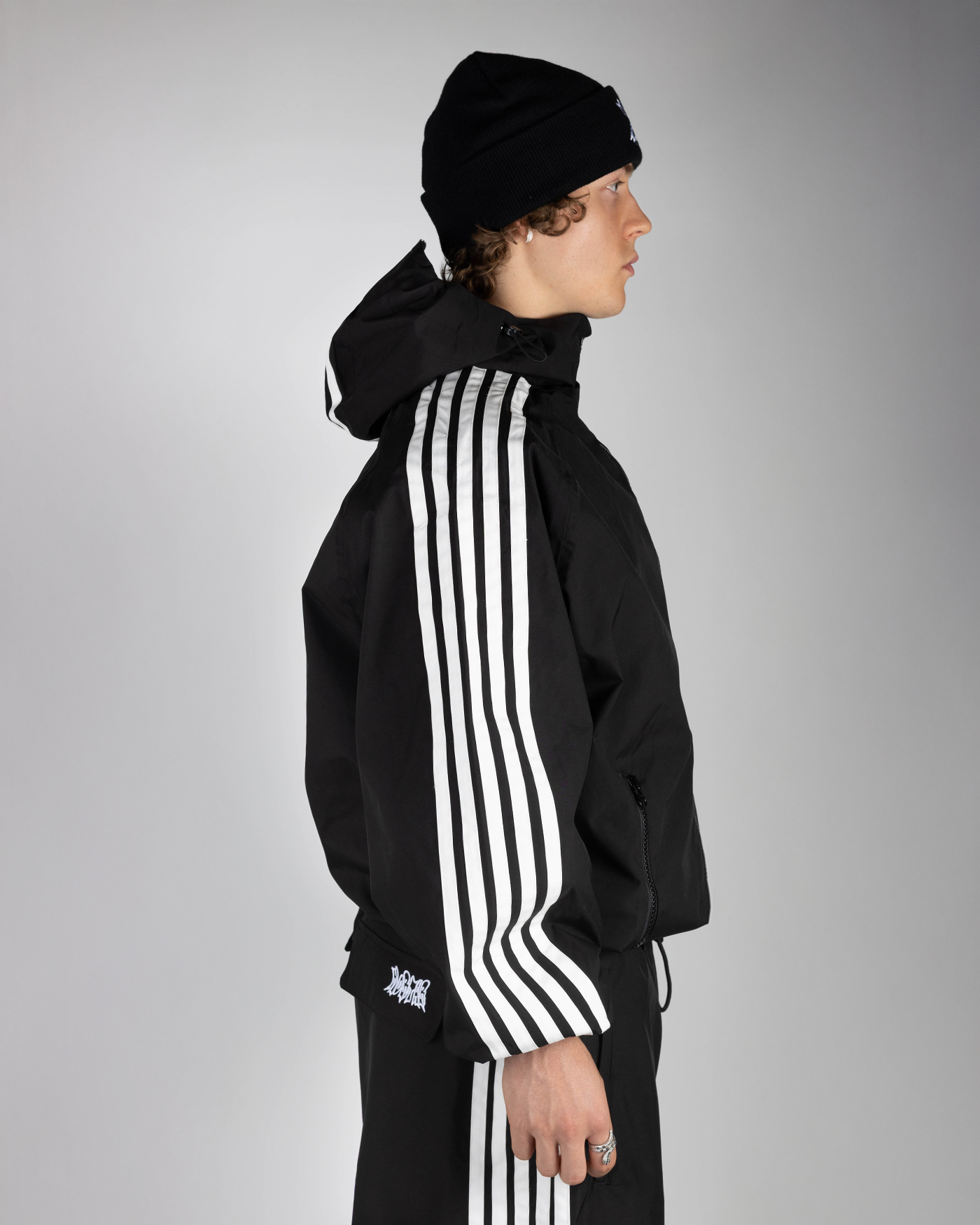 Black stripe snow jacket side view on model