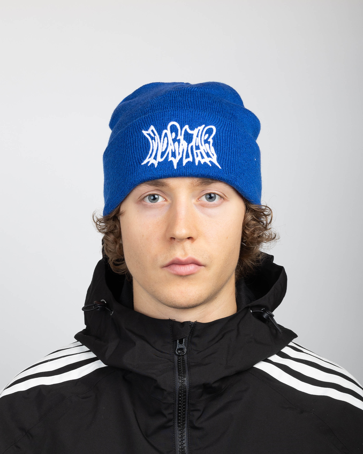Blue beanie full front view on a model