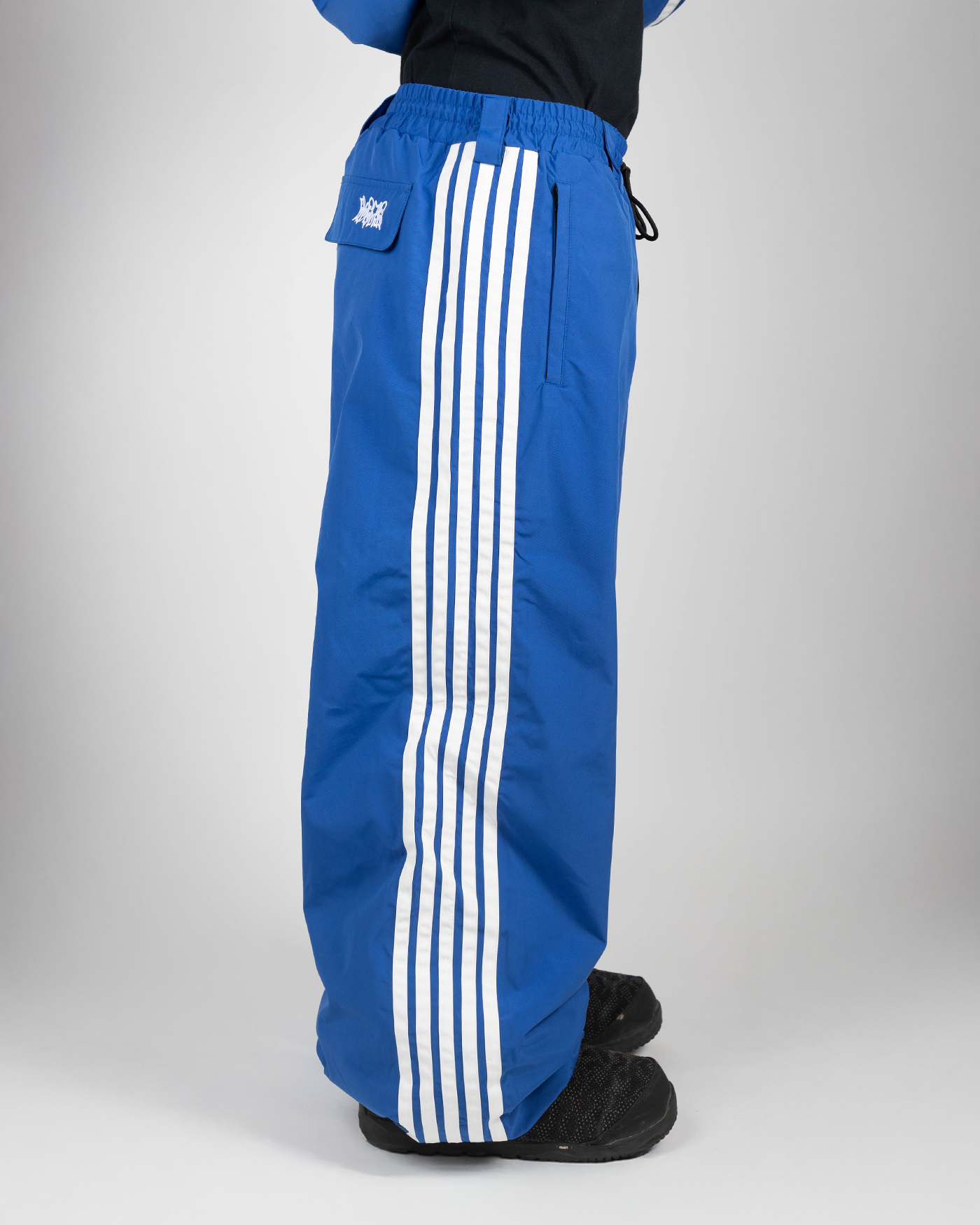 Blue stripe baggy snowpants side view on model