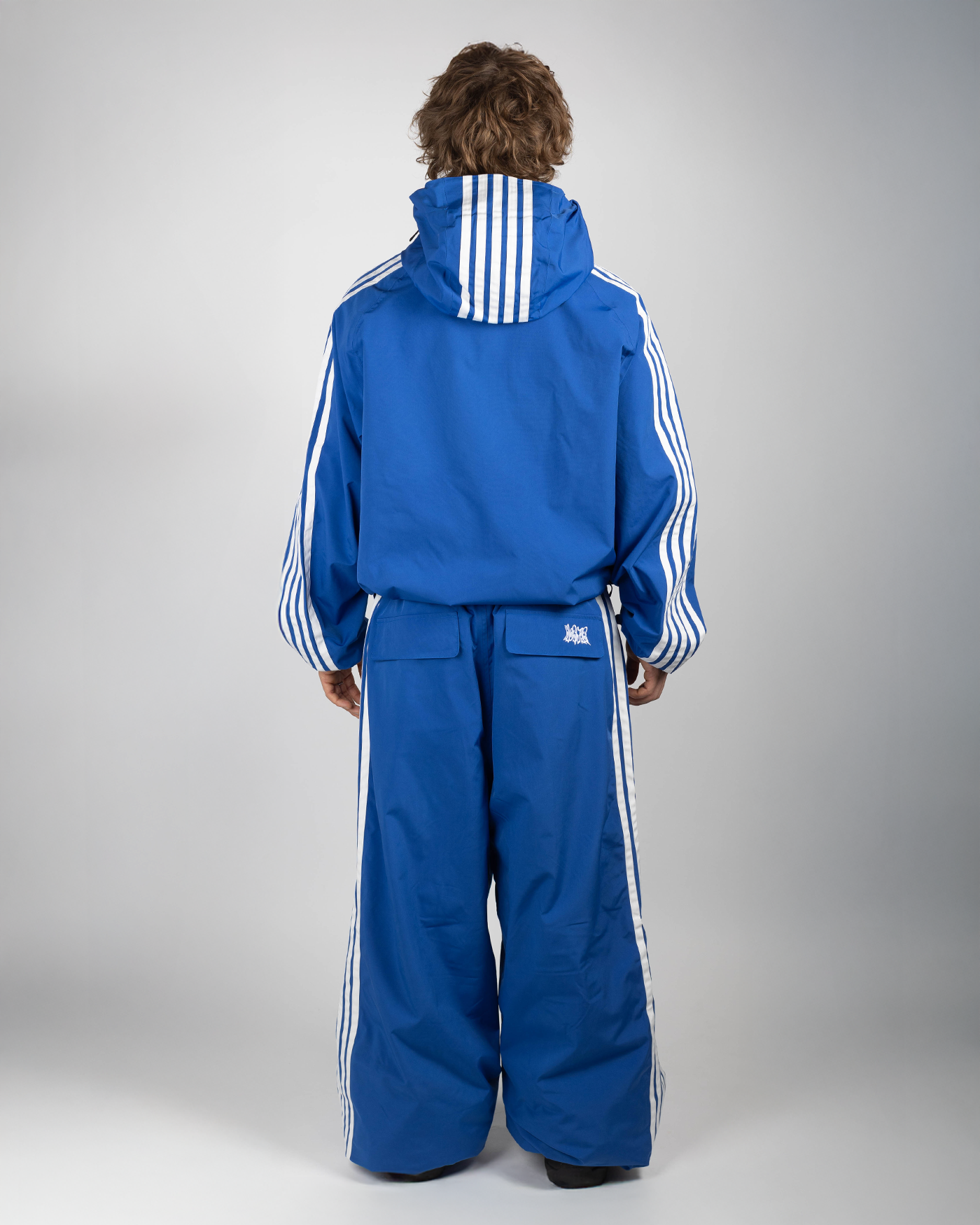 Blue stripe snow jacket on model full back view