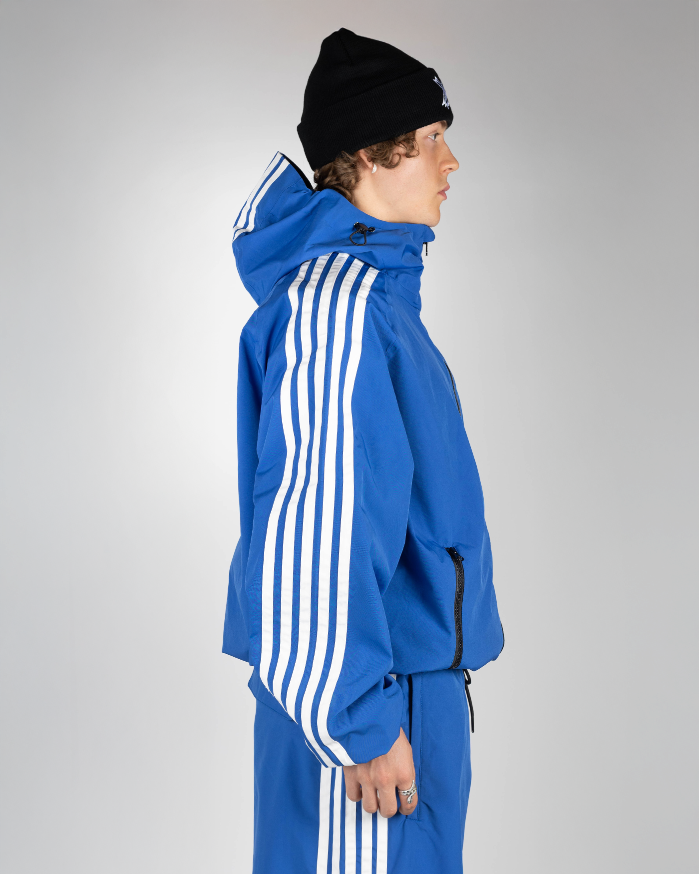 Blue stripe snow jacket side view on model