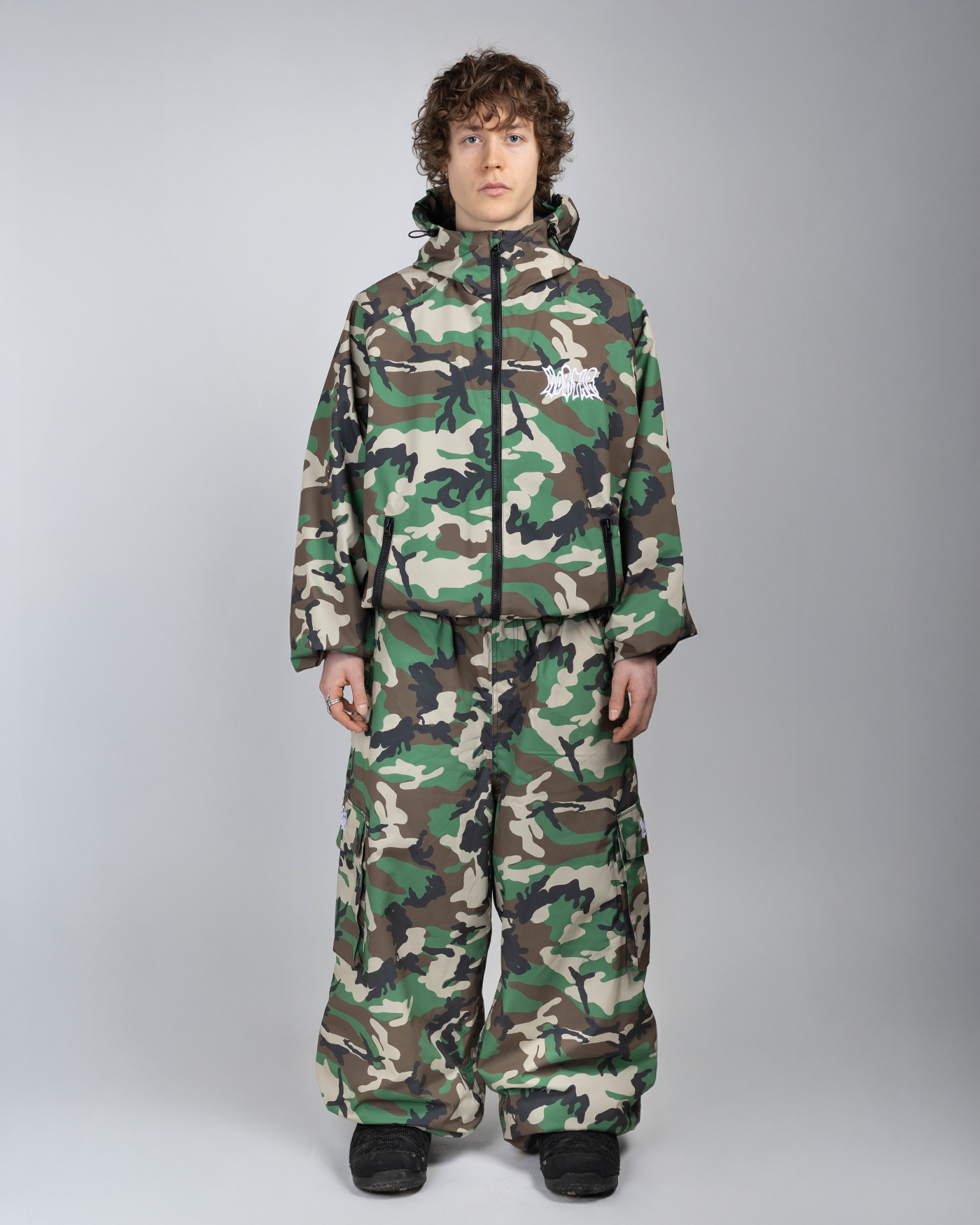 Camo baggy snowpants full front view on a man