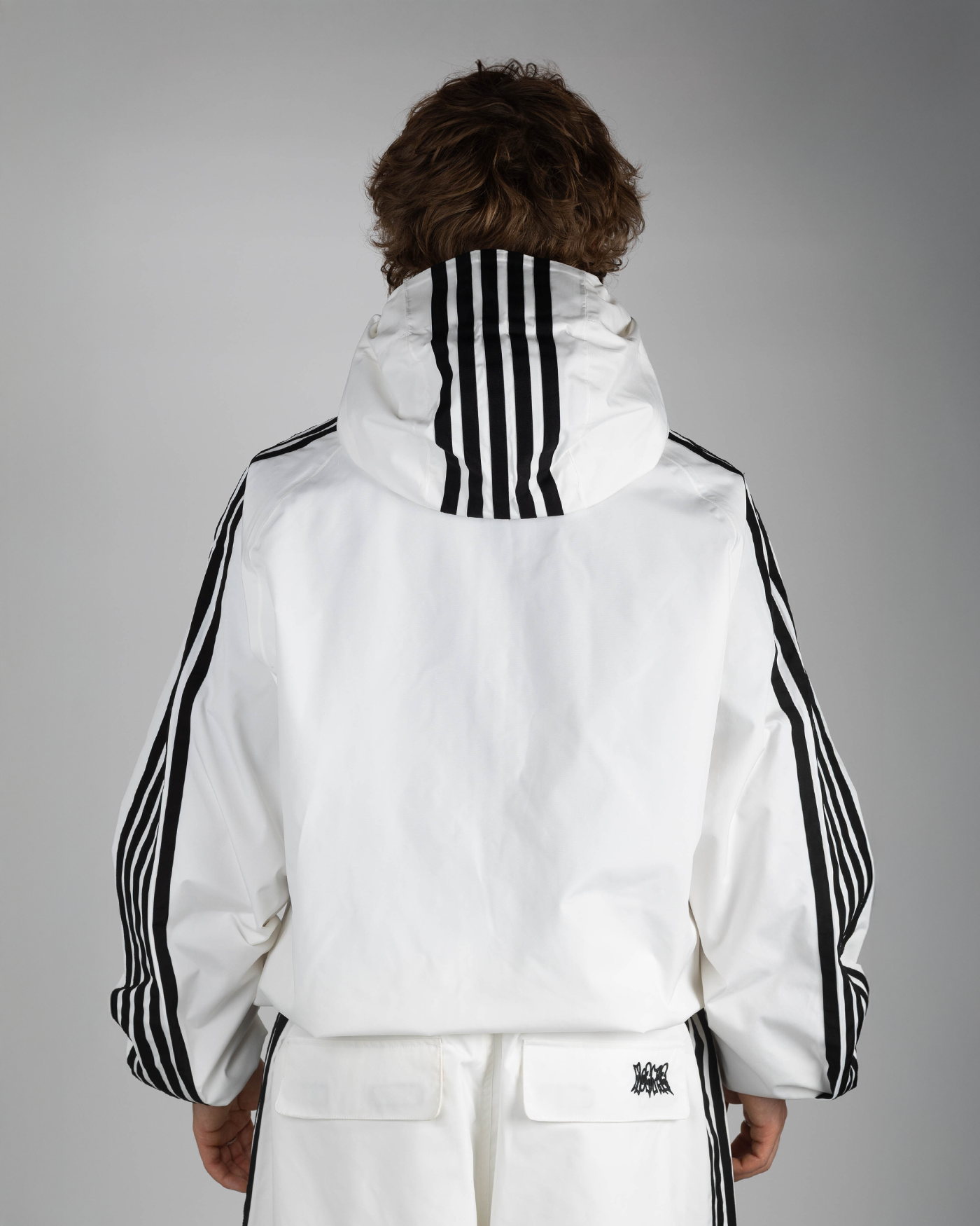 White stripe snow jacket back view on model