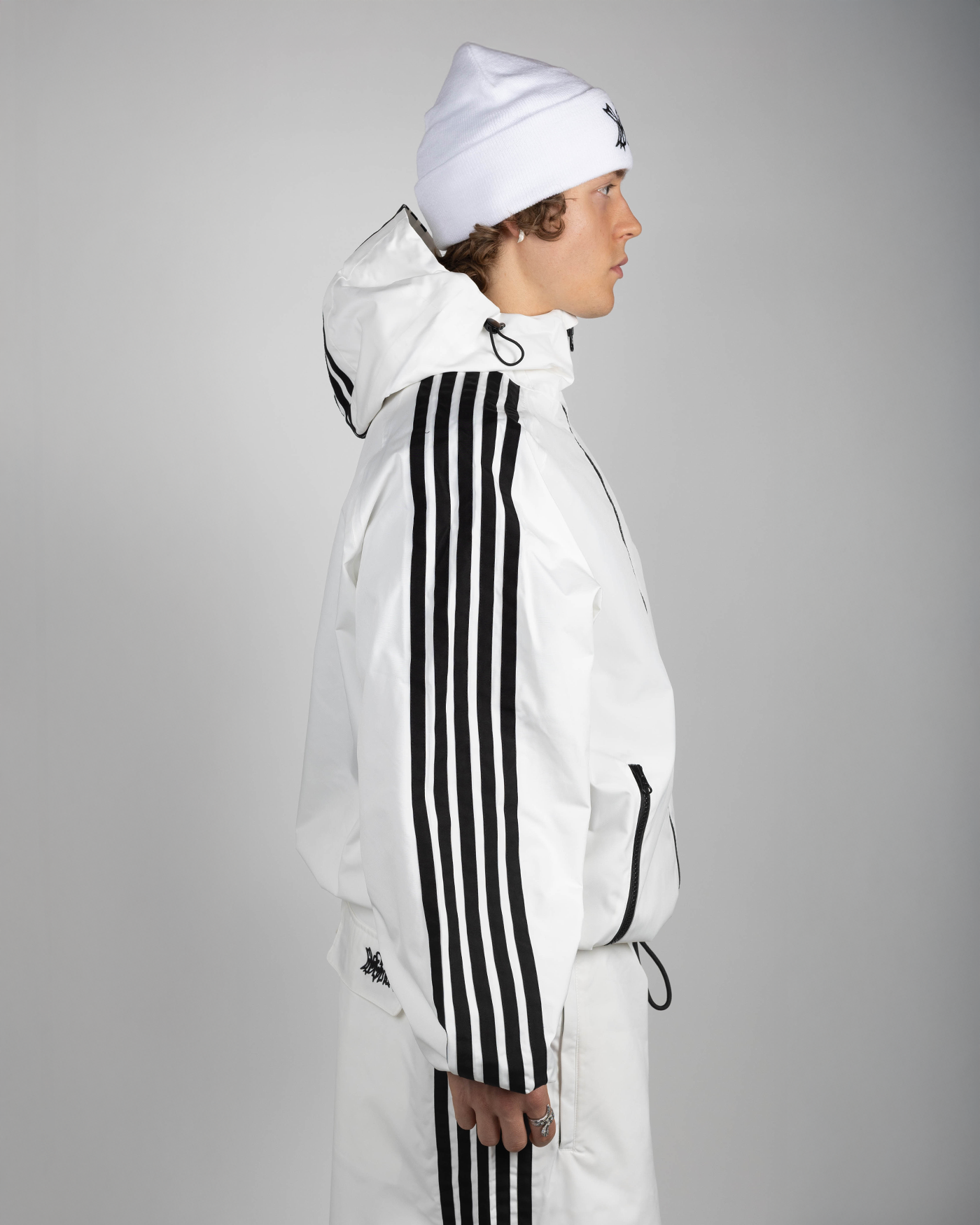 White stripe snow jacket side view on model