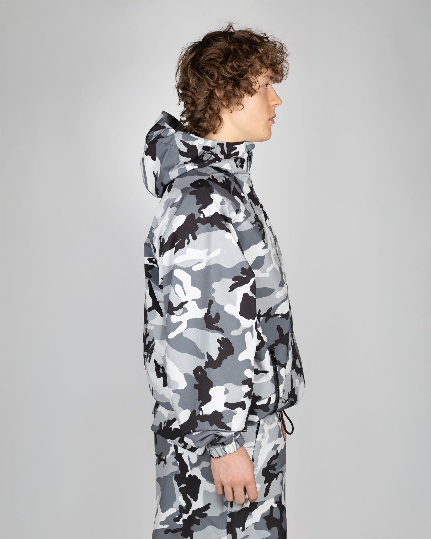 Winter camo snow jacket side view on model